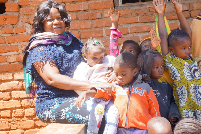 Malawi woman and children in community